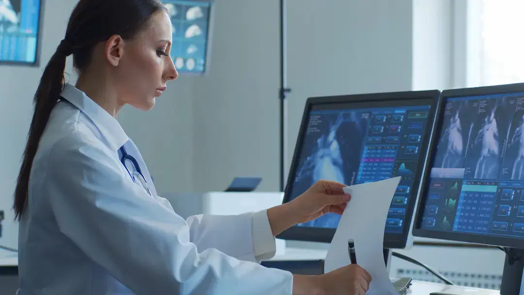 Doctor checking on patients heart